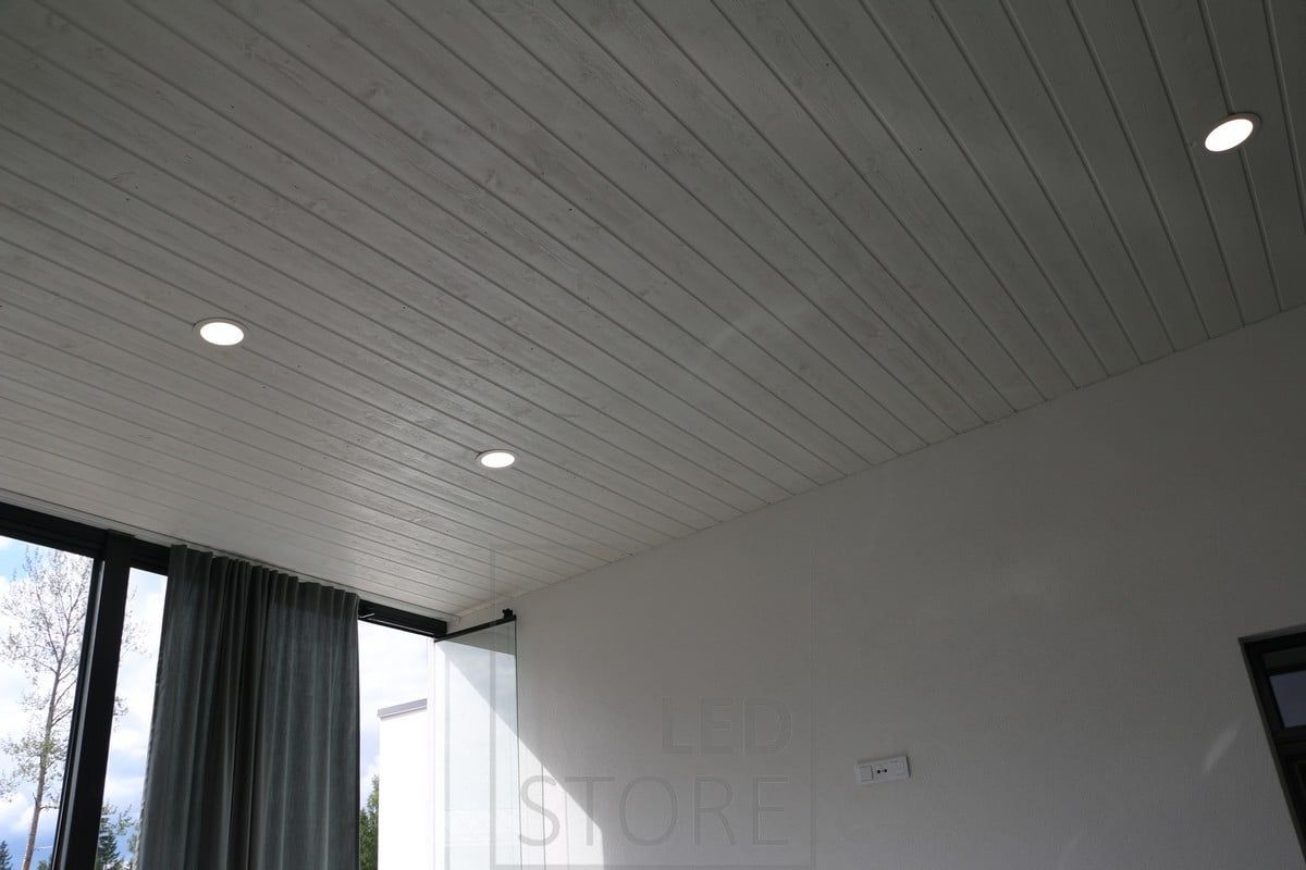 A modern minimalist plafond pleasantly illuminating the living room from the sloping ceiling. Ledstore.fi